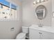 Clean bathroom with white vanity and oval mirror at 3300 W Florida Ave # 77, Denver, CO 80219