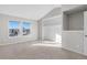 Bright bedroom with carpet, large windows, and spacious closet at 3300 W Florida Ave # 77, Denver, CO 80219