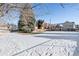 Community area with basketball court and snow covered yard at 3300 W Florida Ave # 77, Denver, CO 80219