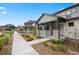 Stylish home with stone pillar accents, covered porch, landscaped garden and walkway, in a well-maintained community at 7040 Homeplace St, Castle Rock, CO 80108