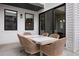 An outdoor patio with wicker seating, ideal for relaxing and dining al fresco at 7040 Homeplace St, Castle Rock, CO 80108
