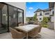 Outdoor patio featuring comfortable seating, a dining area, and a pleasant view of the backyard at 7040 Homeplace St, Castle Rock, CO 80108
