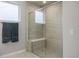 The shower showcases glass enclosure and built-in seating, offering a spa-like experience at 7040 Homeplace St, Castle Rock, CO 80108