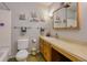 Bathroom featuring a vanity, mirror, wall art, and a shower and tub at 3035 S Biscay St, Aurora, CO 80013