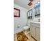 Bathroom featuring a vanity with mirror, a toilet, and a tub and shower combo at 3035 S Biscay St, Aurora, CO 80013