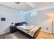 Bedroom featuring a bed, night stand, window, and LED lighting at 3035 S Biscay St, Aurora, CO 80013