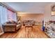 Inviting living room with hardwood flooring and classic decor, perfect for relaxation and entertaining guests at 3035 S Biscay St, Aurora, CO 80013