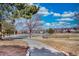 View of a tree-lined path in the neighborhood, inviting residents to enjoy nature and stroll outdoors at 3035 S Biscay St, Aurora, CO 80013