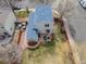 Aerial view of home highlighting the backyard, patio, and landscaping at 1495 Hummingbird Cir, Brighton, CO 80601