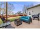 Backyard with a seating area, privacy fence and a barbeque grill at 1495 Hummingbird Cir, Brighton, CO 80601