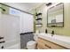 Stylish bathroom features modern fixtures, vanity, and tub with shower at 1495 Hummingbird Cir, Brighton, CO 80601