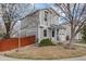 Charming two-story home with a well-maintained lawn, a single-car garage, and blooming trees at 1495 Hummingbird Cir, Brighton, CO 80601