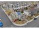 Inviting two-story home with blooming tree and well-maintained front yard at 1495 Hummingbird Cir, Brighton, CO 80601