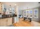 Bright open layout of kitchen and dining area flowing into the living space at 1495 Hummingbird Cir, Brighton, CO 80601