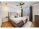 Serene main bedroom with a large window, stylish decor, and a comfortable bed at 1495 Hummingbird Cir, Brighton, CO 80601