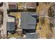 Aerial view of a house with a dark roof, featuring a backyard patio, and a detached garage at 2480 Quitman St, Denver, CO 80212