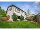 Lush backyard with a patio, lounge area, and barbecue, perfect for outdoor living and entertaining at 2480 Quitman St, Denver, CO 80212