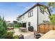 Well-designed backyard with patio, dining area, and barbecue, framed by lush landscaping at 2480 Quitman St, Denver, CO 80212