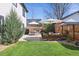 Expansive backyard featuring a patio, grill, and comfortable seating, surrounded by lush greenery at 2480 Quitman St, Denver, CO 80212