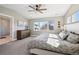 Spacious bedroom featuring a dresser, a carpet, and an ensuite bathroom with a modern glass shower at 2480 Quitman St, Denver, CO 80212