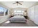 Bright bedroom with vaulted ceilings, a ceiling fan, and abundant natural light from the windows at 2480 Quitman St, Denver, CO 80212