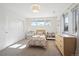 Bright bedroom featuring polka dot accent wall, large windows and built-in storage at 2480 Quitman St, Denver, CO 80212