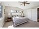 Well-lit bedroom with carpeted floors, vaulted ceilings, and a large window for ample natural light at 2480 Quitman St, Denver, CO 80212