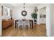 Elegant dining room boasting a modern chandelier and views of the well-manicured yard at 2480 Quitman St, Denver, CO 80212