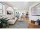 Inviting living room with ample natural light and an open layout to the dining area at 2480 Quitman St, Denver, CO 80212