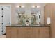 Elegant bathroom featuring a double sink vanity with modern fixtures and ample storage at 8103 Raphael Ln, Littleton, CO 80125