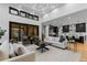 Open concept living space blending sleek kitchen and comfortable sitting area with bright, airy feel at 8103 Raphael Ln, Littleton, CO 80125