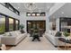 Bright and airy living room with soaring ceilings and seamless indoor-outdoor living at 8103 Raphael Ln, Littleton, CO 80125
