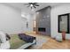 Spacious main bedroom with modern fireplace and large windows at 8103 Raphael Ln, Littleton, CO 80125