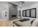 Spacious main bedroom with modern fireplace and large windows at 8103 Raphael Ln, Littleton, CO 80125