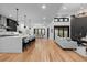Spacious open floorplan with modern kitchen, dining area, and comfortable living space at 8103 Raphael Ln, Littleton, CO 80125