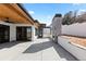 Relaxing outdoor patio featuring a sleek fireplace and ample space for entertaining at 8103 Raphael Ln, Littleton, CO 80125