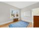 Light-filled bedroom with hardwood floors, radiator, large windows, and neutral walls creating a serene atmosphere at 925 Steele St, Denver, CO 80206