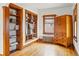 Bedroom with hardwood floors, built-in shelving, and a radiator under the window at 925 Steele St, Denver, CO 80206