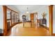 Dining room features hardwood floors, large windows, and classic wood trim at 925 Steele St, Denver, CO 80206