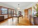 Elegant dining room featuring hardwood floors, large windows, and classic wood trim at 925 Steele St, Denver, CO 80206