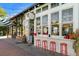 Charming storefront with inviting red stools and large windows displaying treats at 925 Steele St, Denver, CO 80206