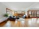 Open-concept living area with hardwood floors, fireplace, and classic wood trim throughout at 925 Steele St, Denver, CO 80206