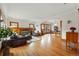 Open-concept living area with hardwood floors, fireplace, and classic wood trim throughout at 925 Steele St, Denver, CO 80206