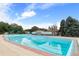 Large outdoor swimming pool with bath house on a clear day at 925 Steele St, Denver, CO 80206