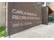 View of the Carla Madison Recreation Center exterior, displaying prominent signage against the red brick facade at 925 Steele St, Denver, CO 80206