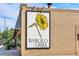 A building's sign with a sunflower and the text 'Barolo Grill' on it at 925 Steele St, Denver, CO 80206