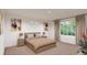 Comfortable bedroom with bedside tables, lamps, and abstract art creating a peaceful atmosphere at 3888 N Riviera Ct, Aurora, CO 80019