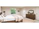 Cozy bedroom with natural light, neutral tones, ensuite bathroom, dresser, and view of the yard at 3888 N Riviera Ct, Aurora, CO 80019