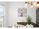 Bright dining space featuring contemporary light fixture and natural light at 21069 Woodside Ln, Parker, CO 80138