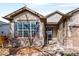 Charming home exterior with a well-maintained yard and decorative water fountain at 21069 Woodside Ln, Parker, CO 80138